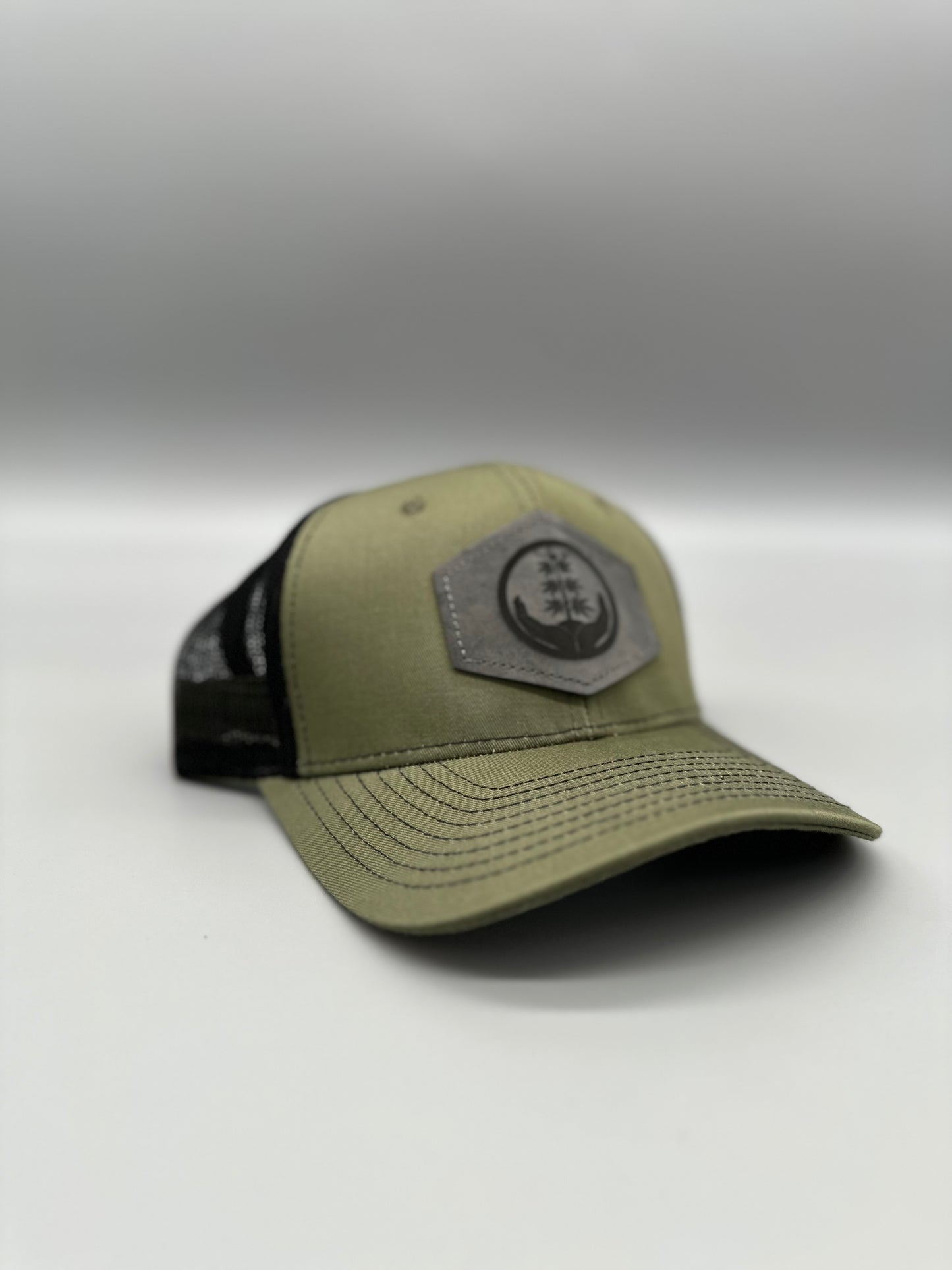 Three A Light trucker hat in a sage color